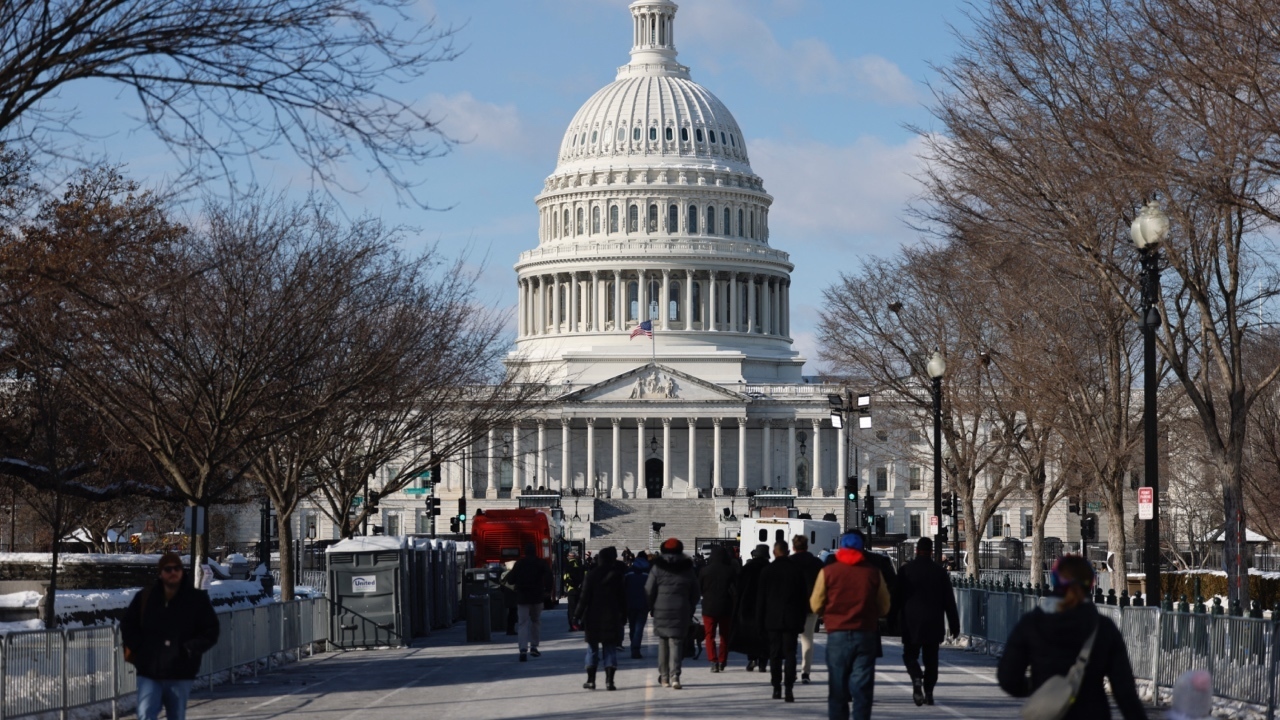 Scores wait in bitter DC cold to pay respects to Jimmy Carter: ‘An honorable man’